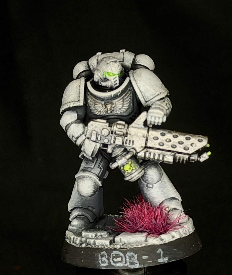 Bob-1, the first physical production model for the beta testers, painted in grayscale with green accents and a magenta tuft.